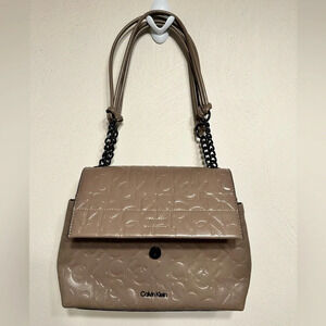 Calvin Klein logo purse. Leather and chain strap. Taupe color, 3 compartments
